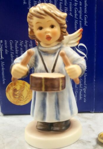 Hummel angel plays a drum.